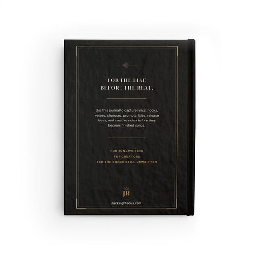 Black notebook with gold text on a white background