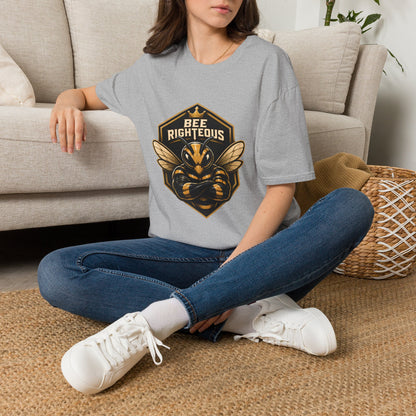 Person wearing a t-shirt with 'Wild Rides' graphic design sitting on a couch.
