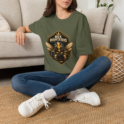 Person wearing a green t-shirt with 'Dungeon Brew' design sitting on a carpeted floor.