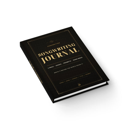 Black songwriting journal with gold text on a white background