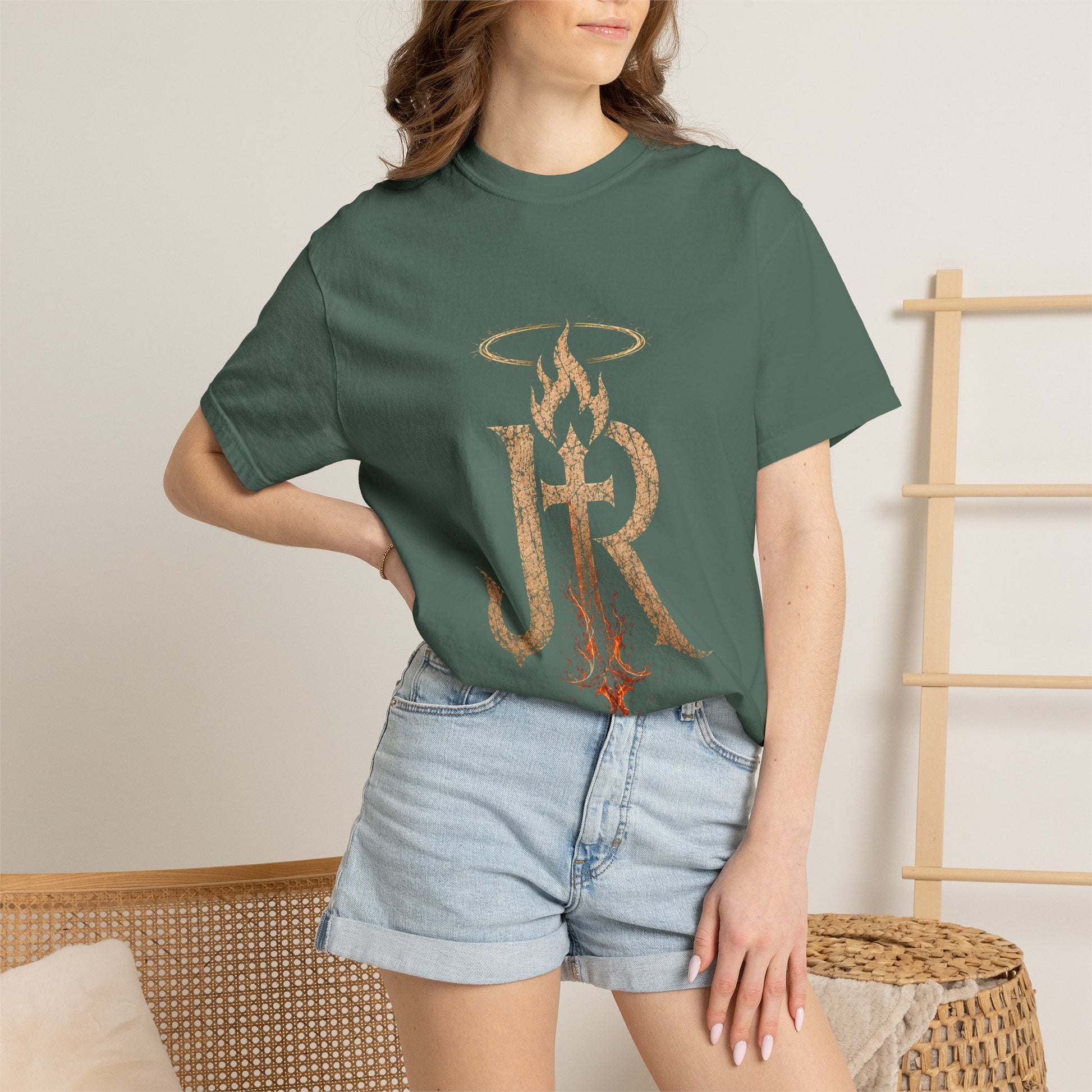 Person wearing a green t-shirt with 'Austin Texas' design and denim shorts indoors.