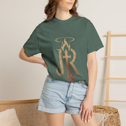 Person wearing a green t-shirt with 'Austin Texas' design and denim shorts indoors.