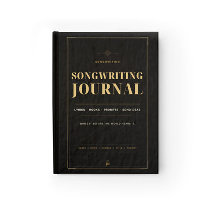 Songwriting journal with gold text on a black cover against a white background