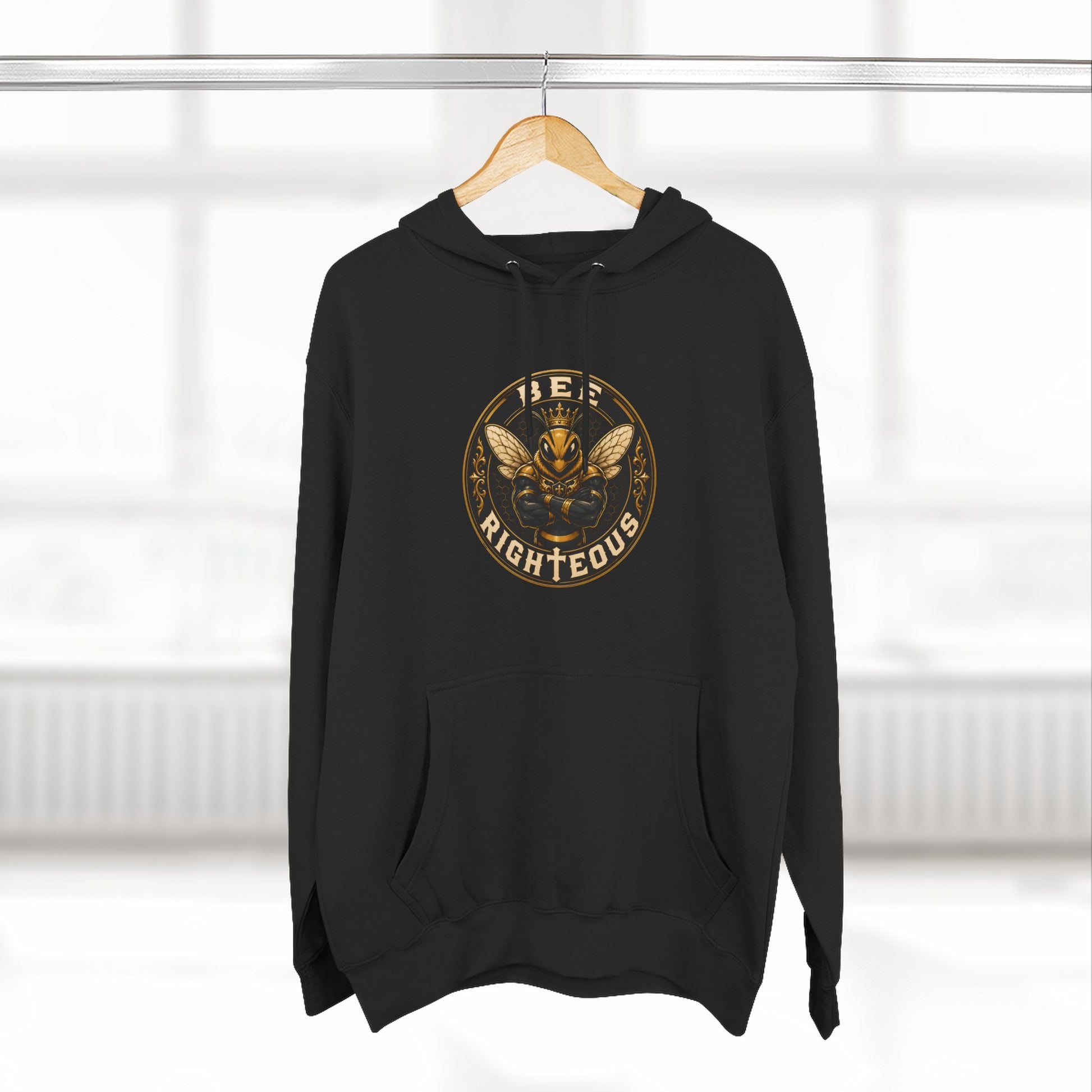 Navy blue hoodie with white graphic design on a hanger against a white background