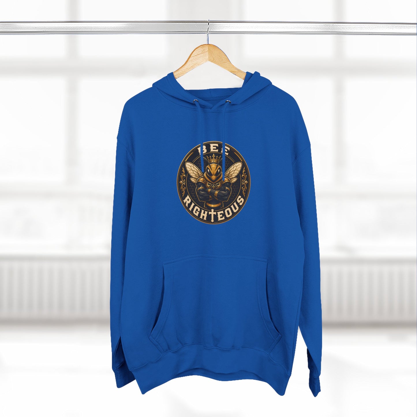 Blue hoodie with a circular logo on a hanger against a white background