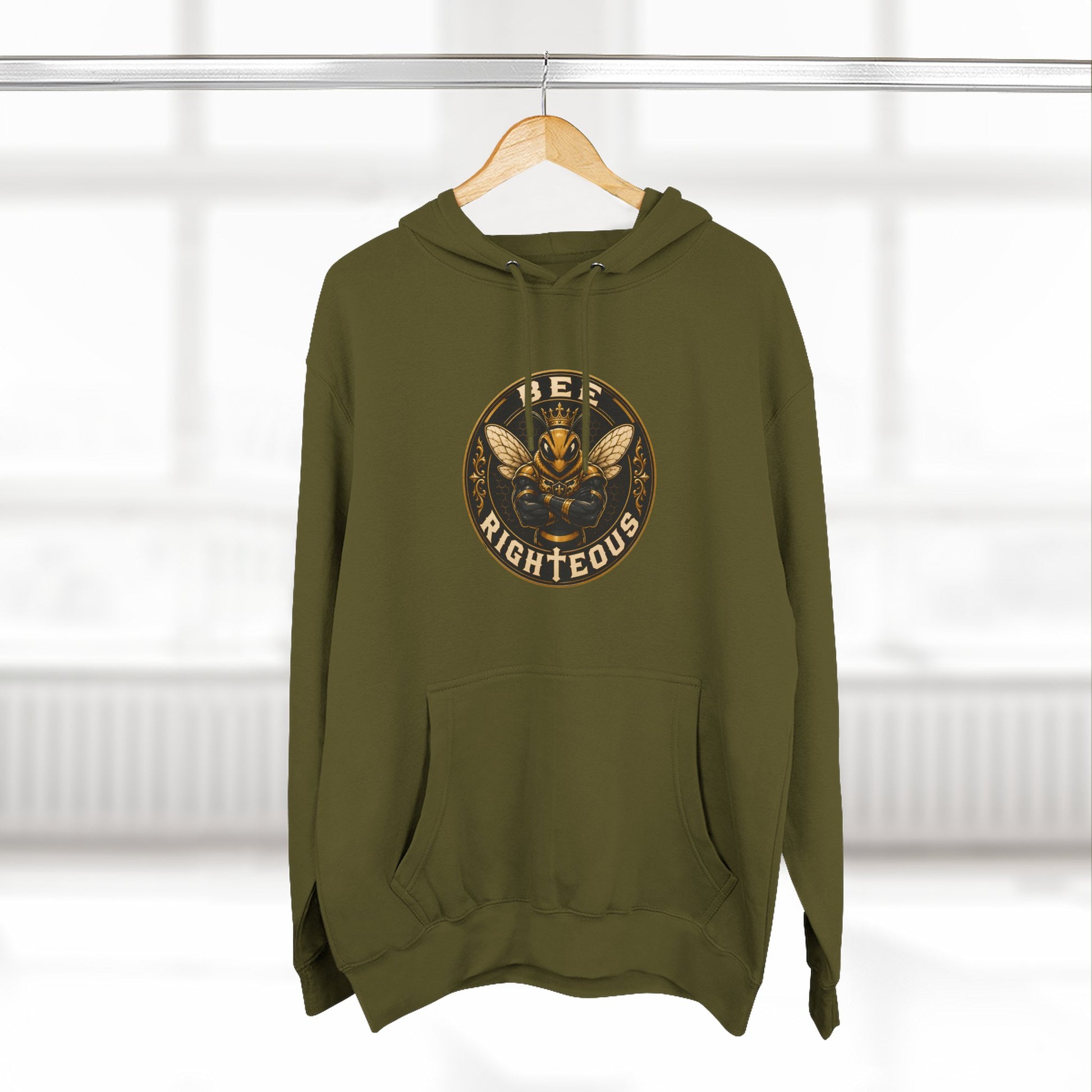 Black hoodie on a wooden hanger against a white background