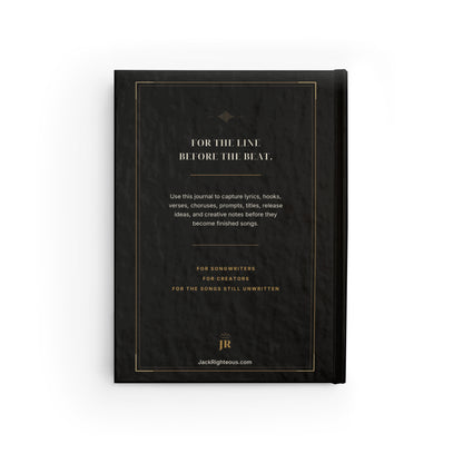 Black notebook with gold text on a white background