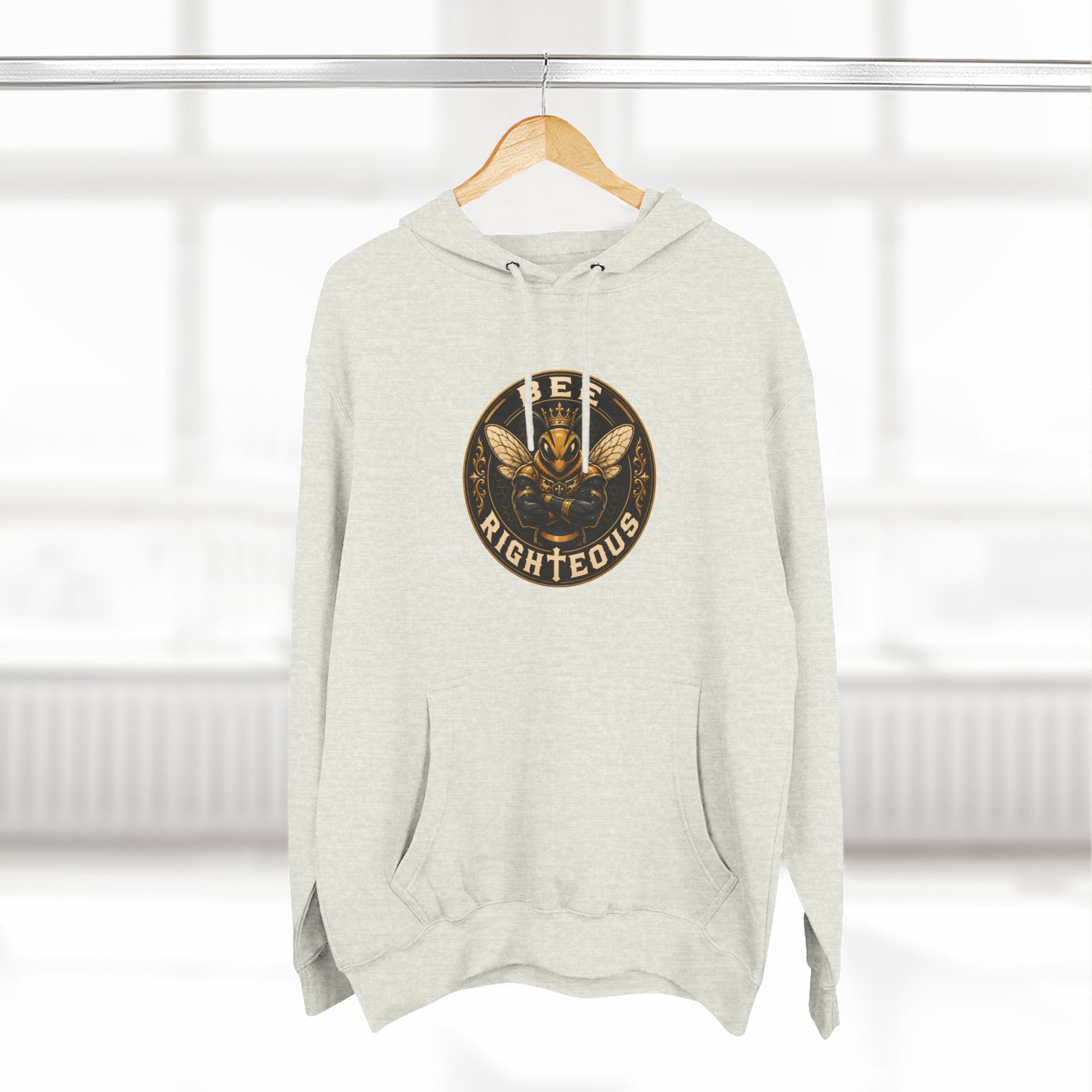 Gray hoodie with a logo on a hanger against a white background
